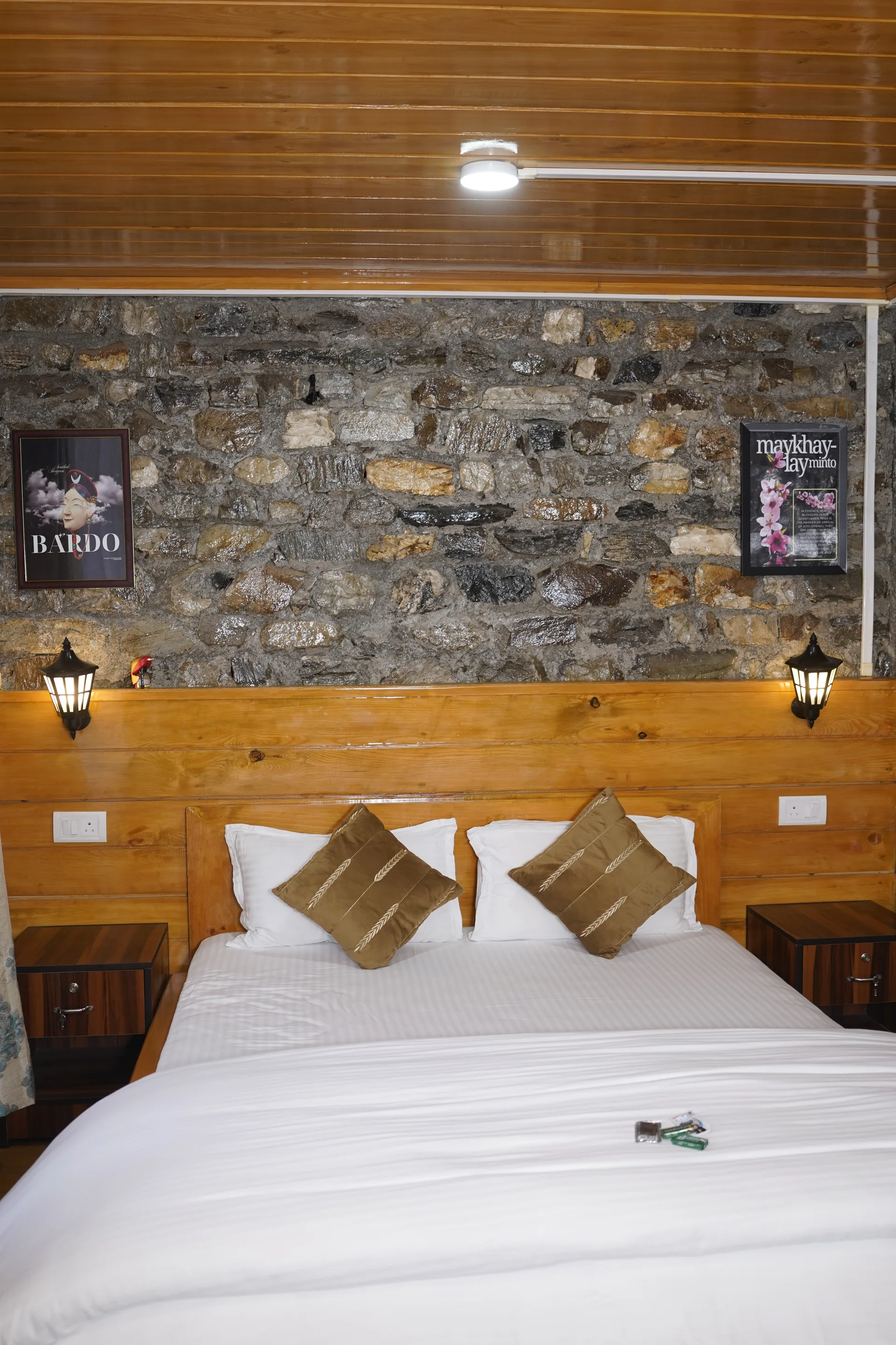 Room with stone feature wall overhead view at Acorn Homestay