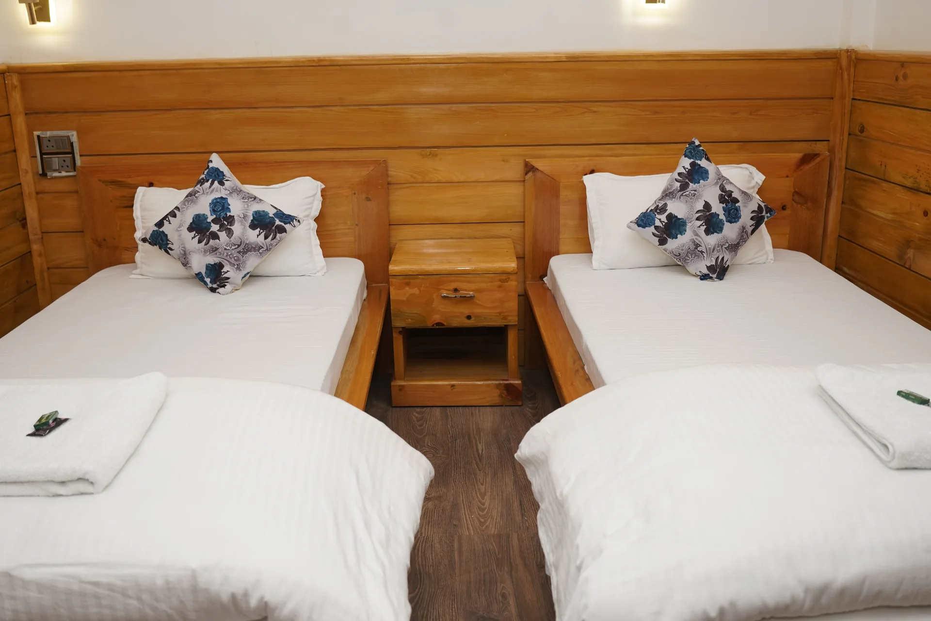 Twin bed room interior at Acorn Homestay Shergaon